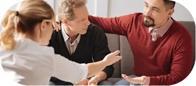 Therapist facilitating OCD and co-occurring disorders group session discussion.