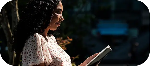 Woman reading in natural light, symbolizing mental well-being and reflection in depression care context, Madison, WI.