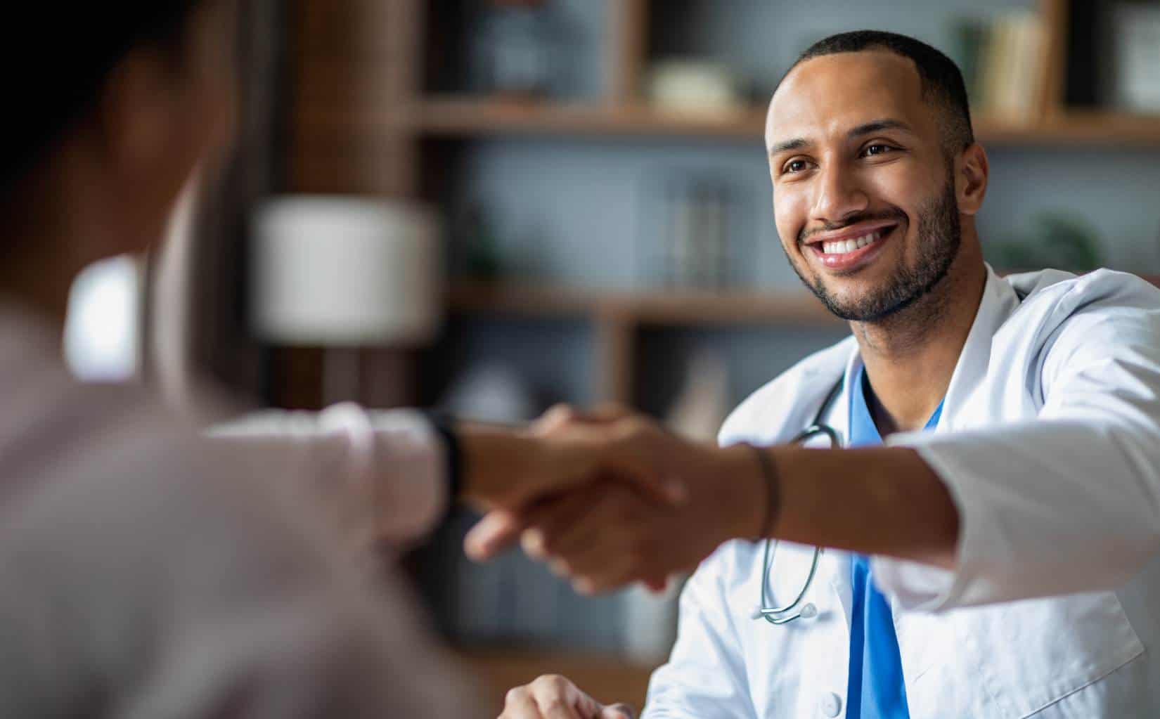Physician welcoming a client during intake at IOP in Madison, WI.