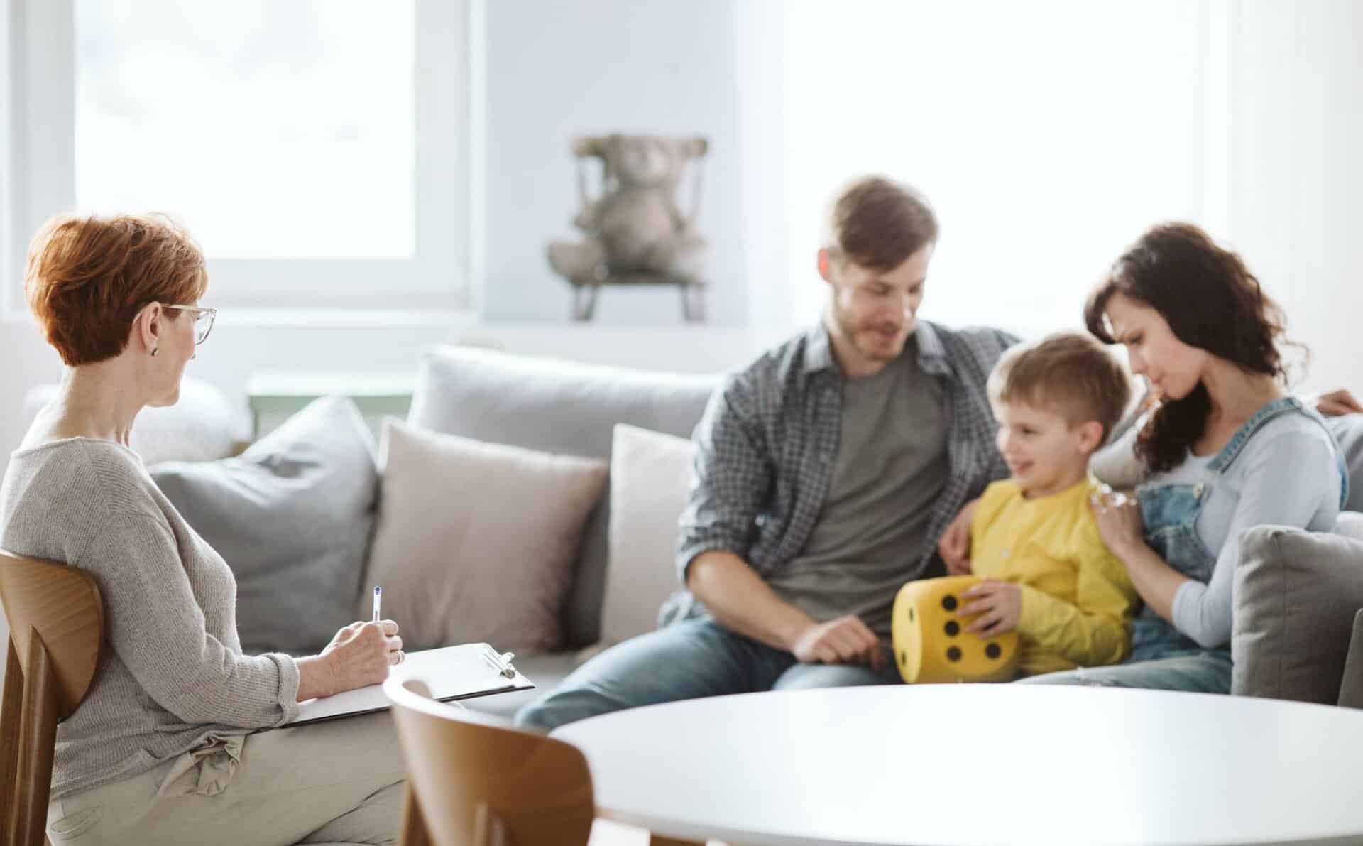 Therapist guiding a family therapy session in Madison, WI.