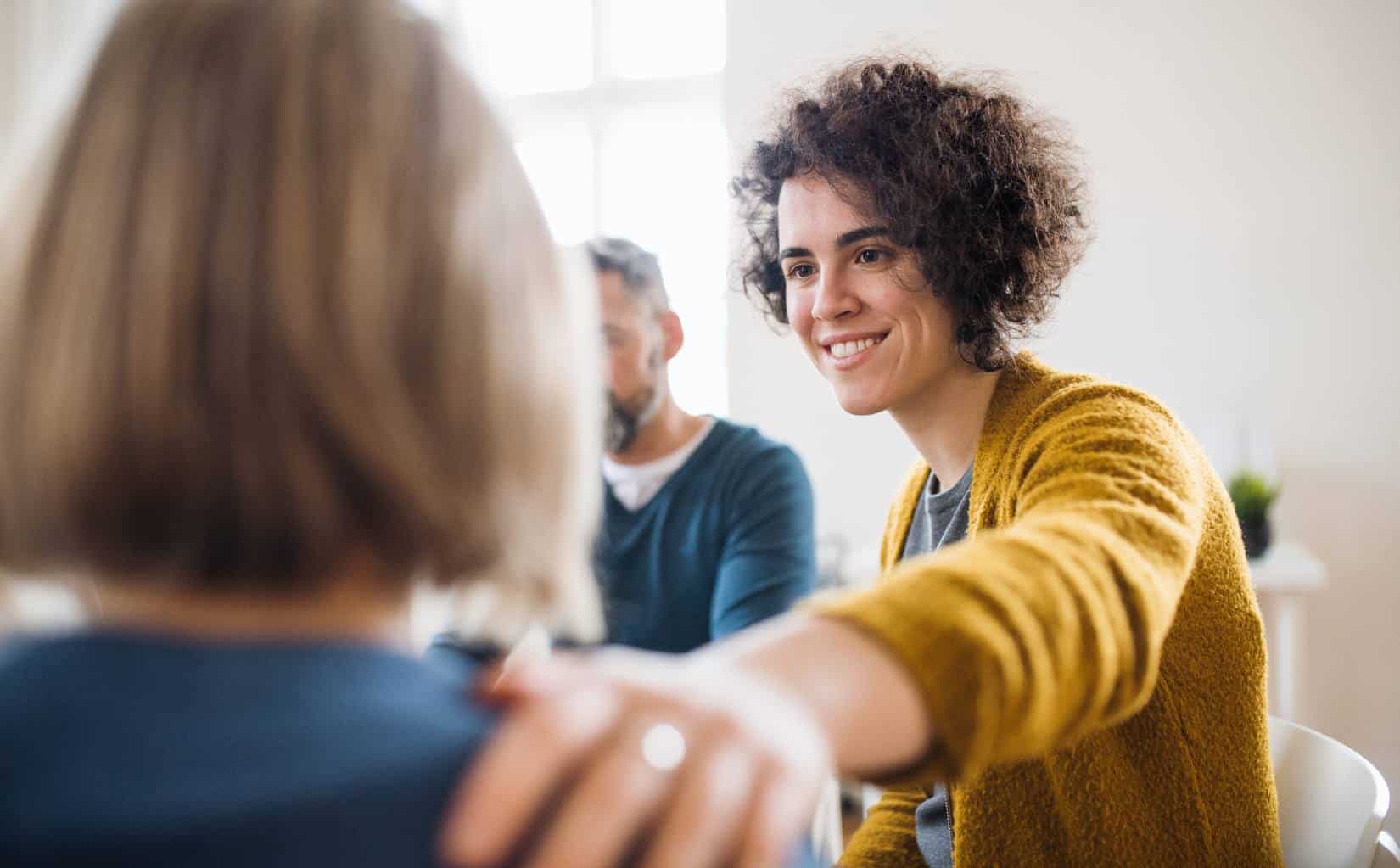Clients supporting each other in group therapy in Madison, WI.