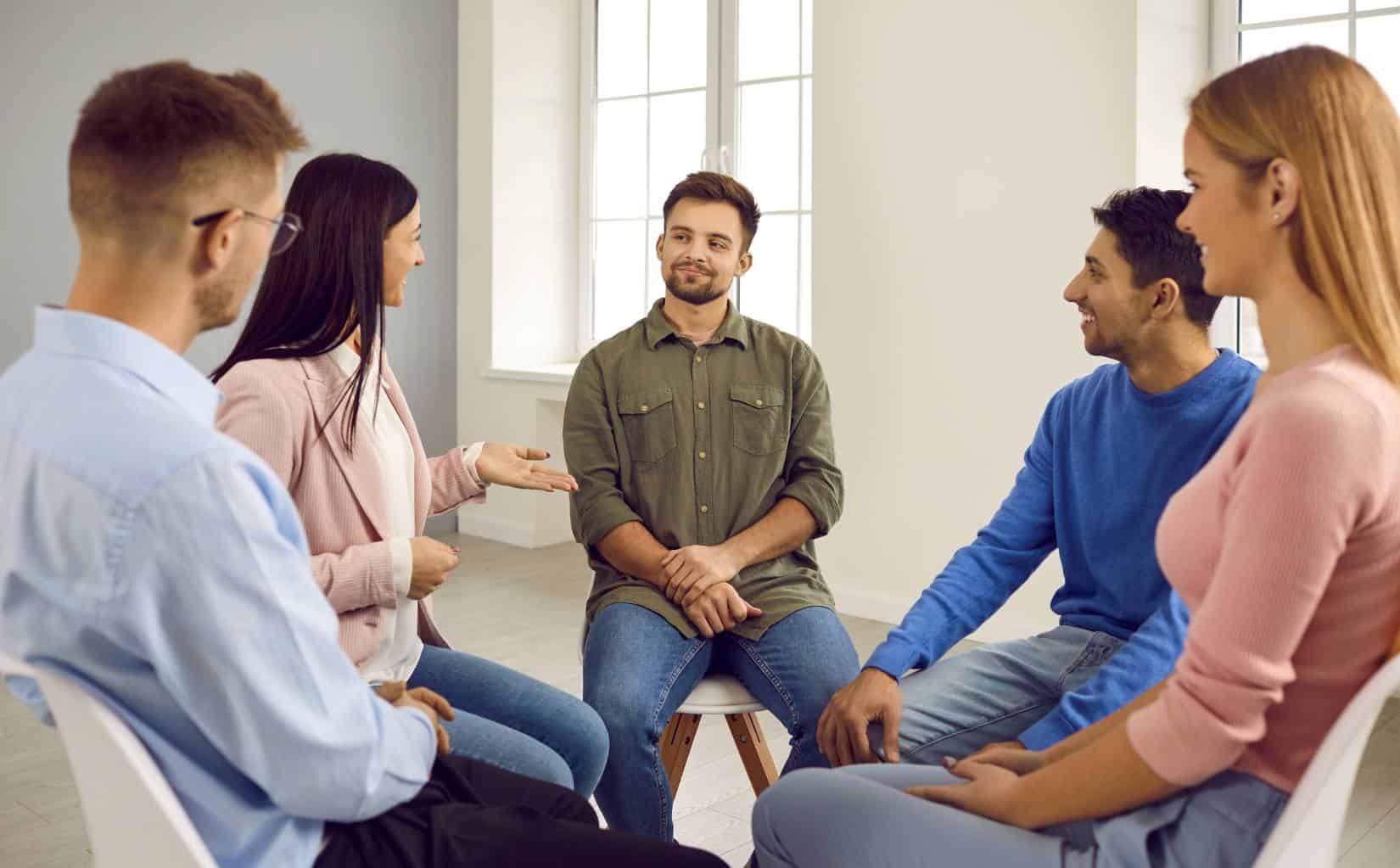 Guided discussion in group therapy.
