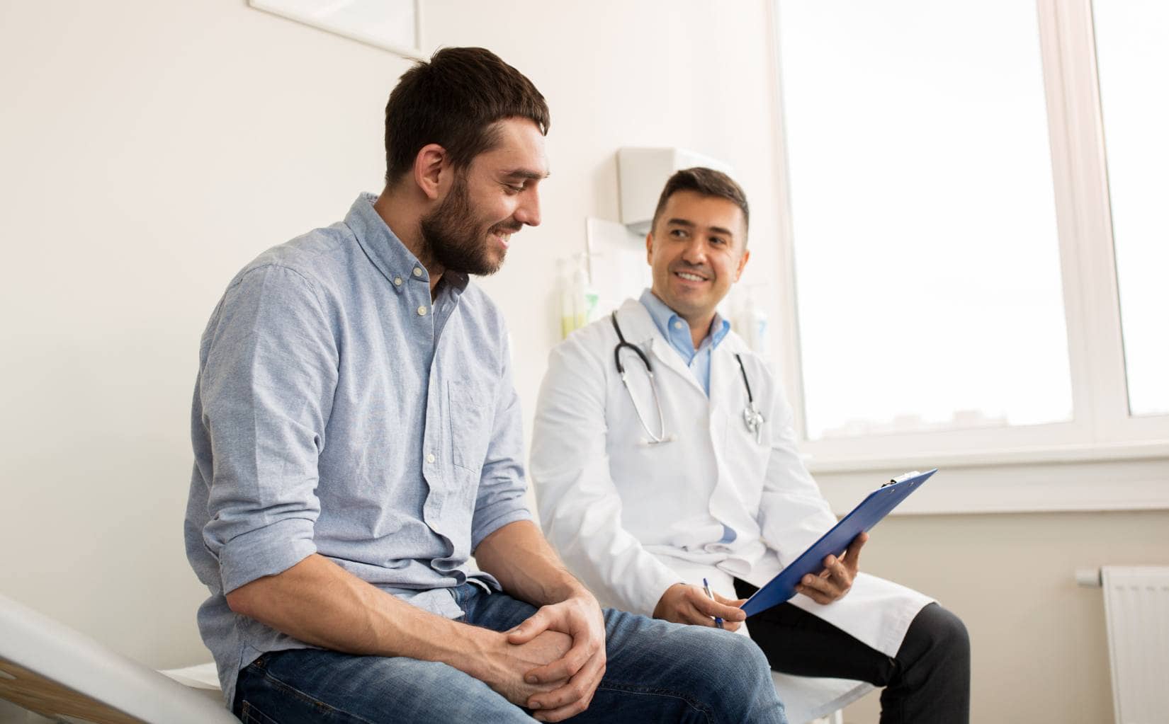 Physician supporting a client in drug addiction treatment in Madison, WI.