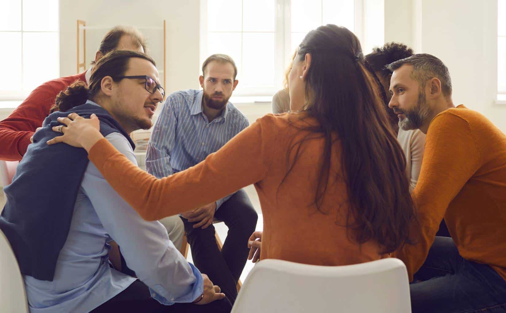 Clients participating in group therapy for drug addiction treatment in Madison, WI.