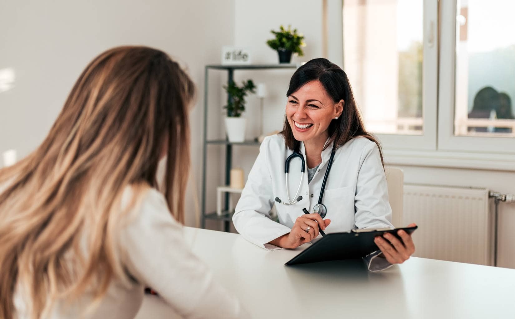 Doctor consulting with a client for drug addiction treatment in Madison, WI.