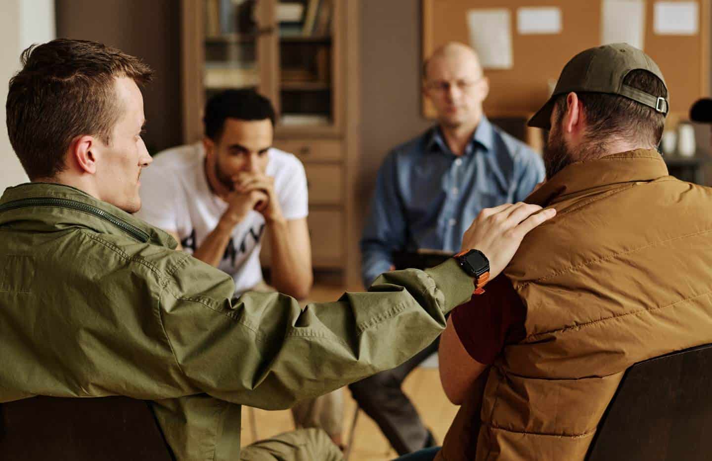 Group therapy session during rehab for men in Madison, WI.