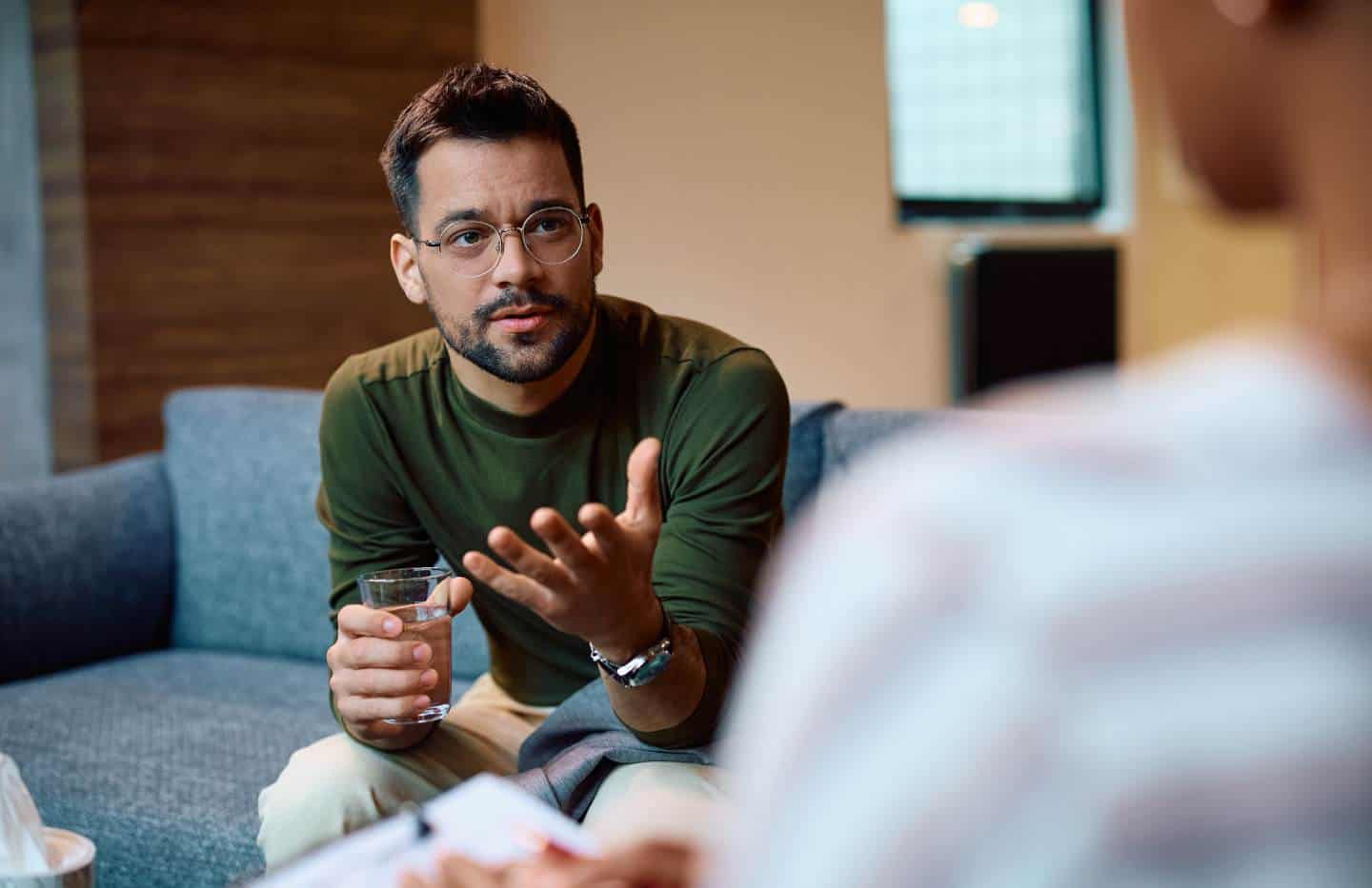 Man meeting one-on-one with a therapist during rehab for men in Madison, WI.