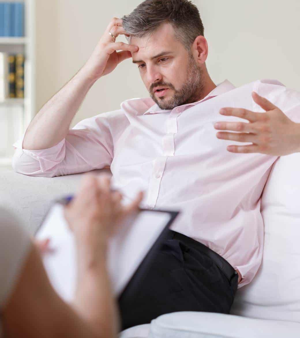 Man speaking with a therapist during rehab for men in Madison, WI.