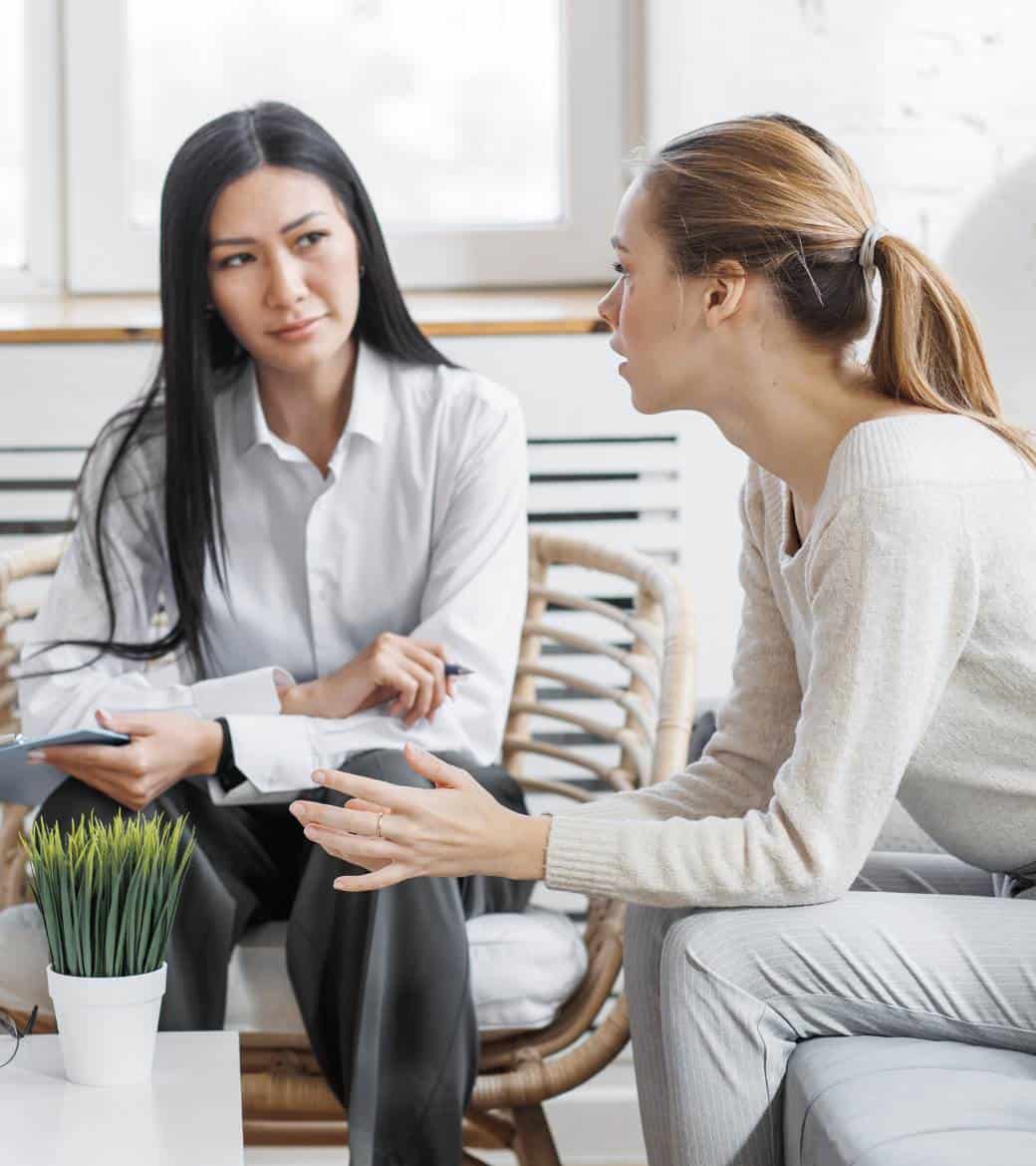 Therapist providing guidance during rehab for young adults in Madison, WI.