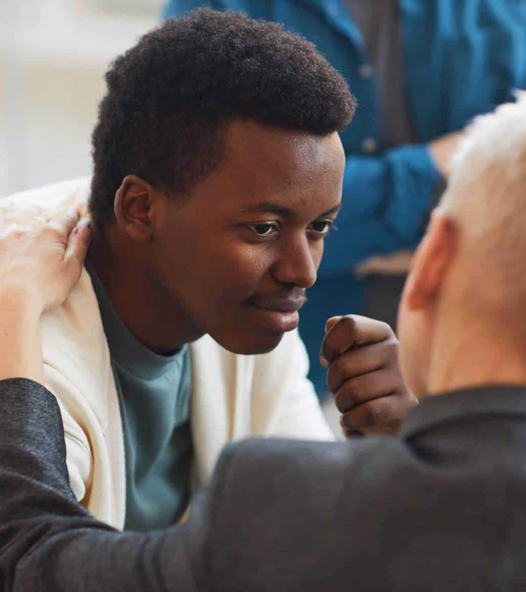 Therapist providing guidance during rehab for young adults in Madison, WI.