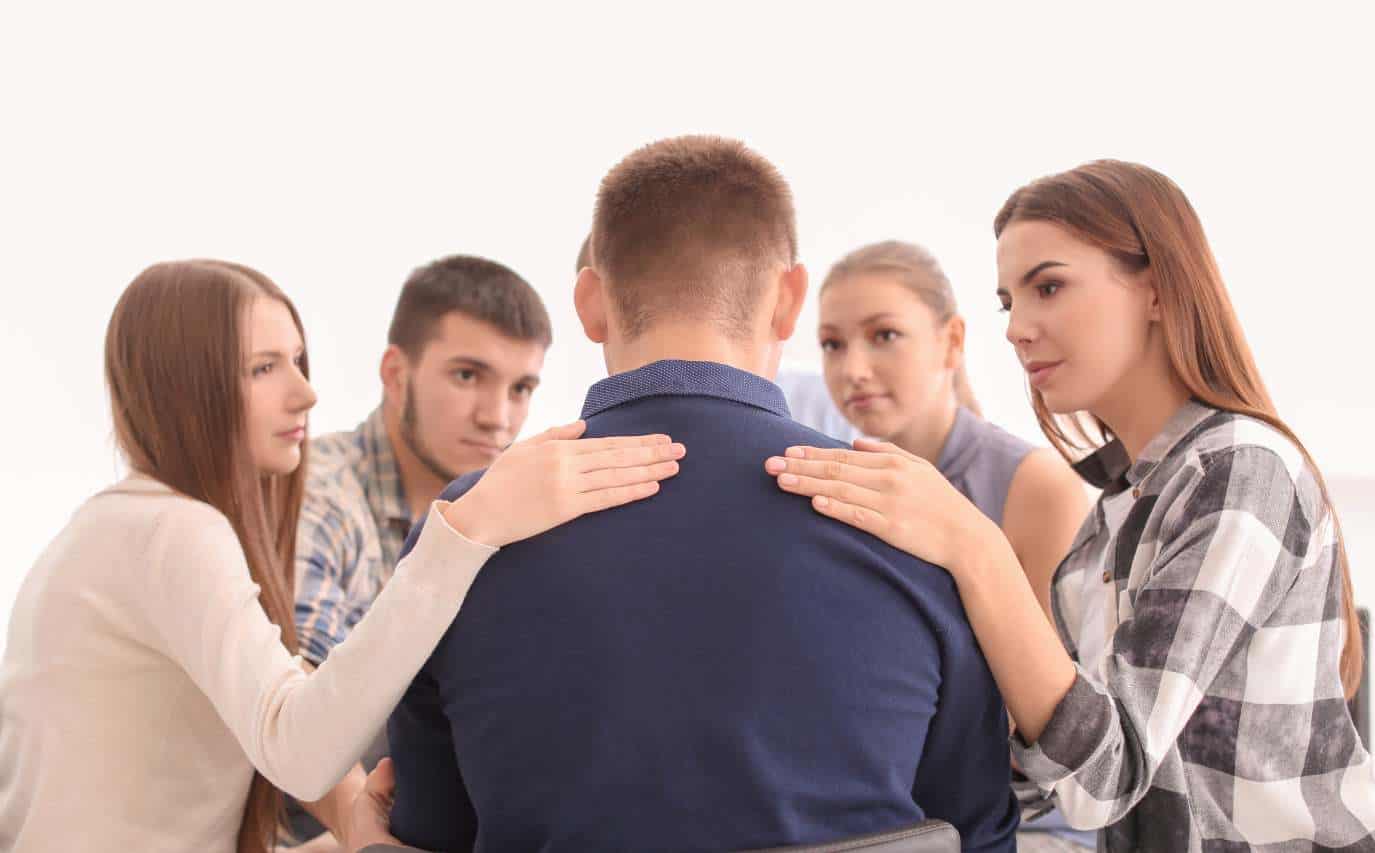 People encouraging one another during Xanax addiction treatment in Madison, WI.