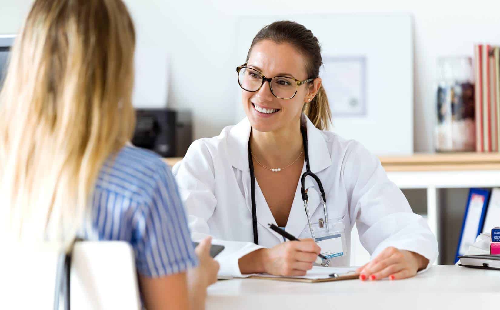Smiling doctor speaking with a patient during marijuana addiction treatment in Madison, WI.