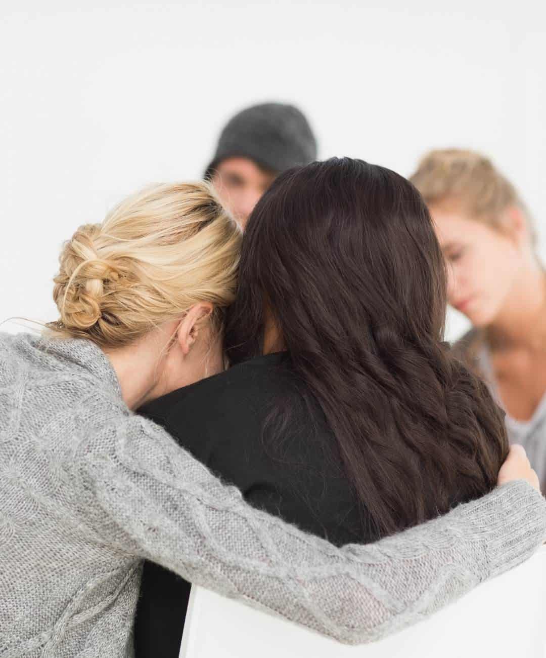 People encouraging one another during meth addiction treatment in Madison, WI.