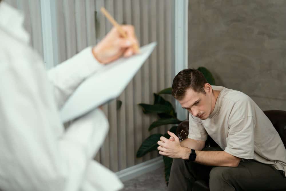 Man talking with a psychologist during opioid rehab in Madison at Willow Behavioral Health.