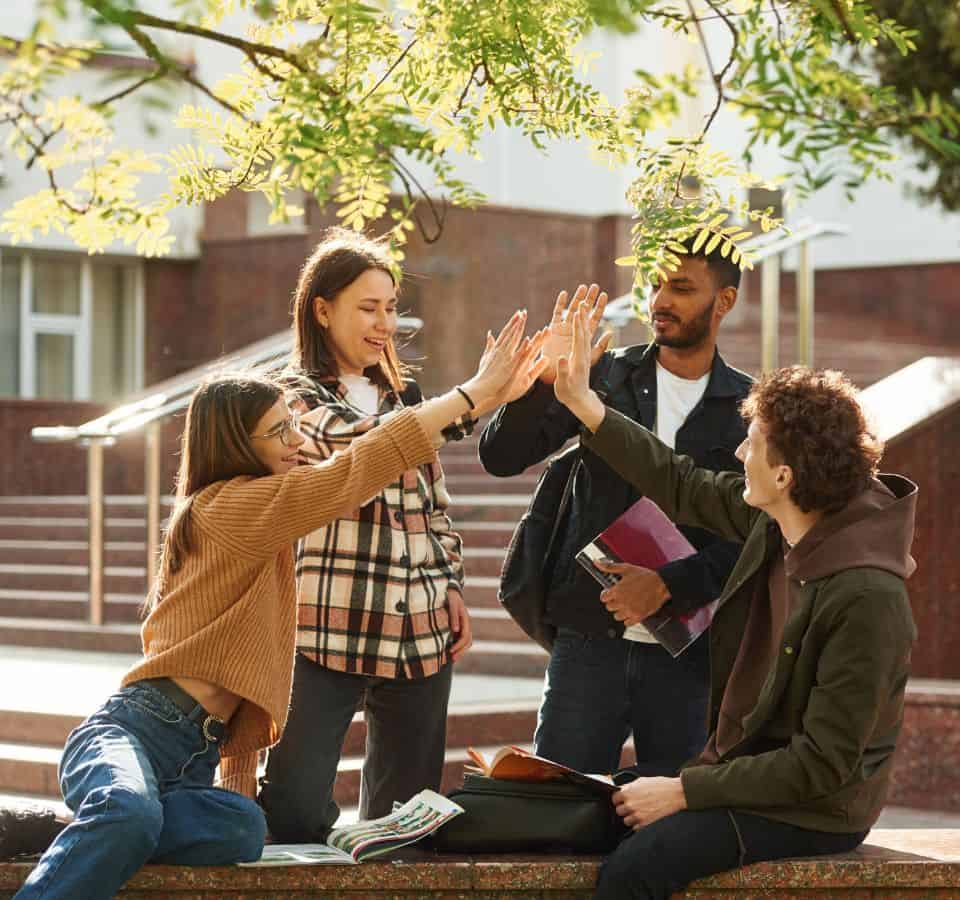 Students greeting each other during behavioral health treatment for students in Madison, WI.