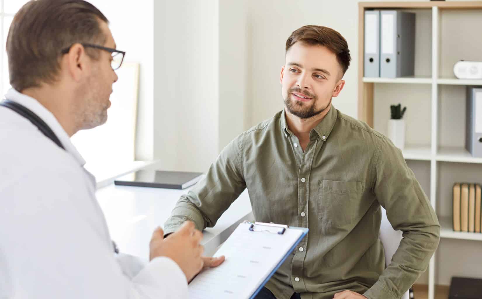 Man consulting a doctor about whether anxiety can be treated without medication.