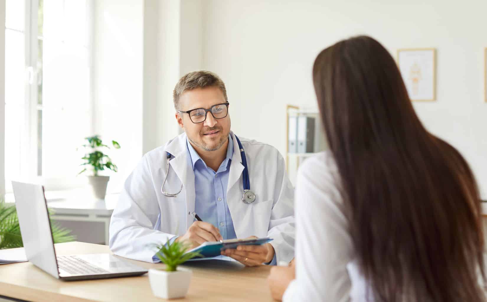 Woman reviewing her medications with a doctor in Madison, WI.