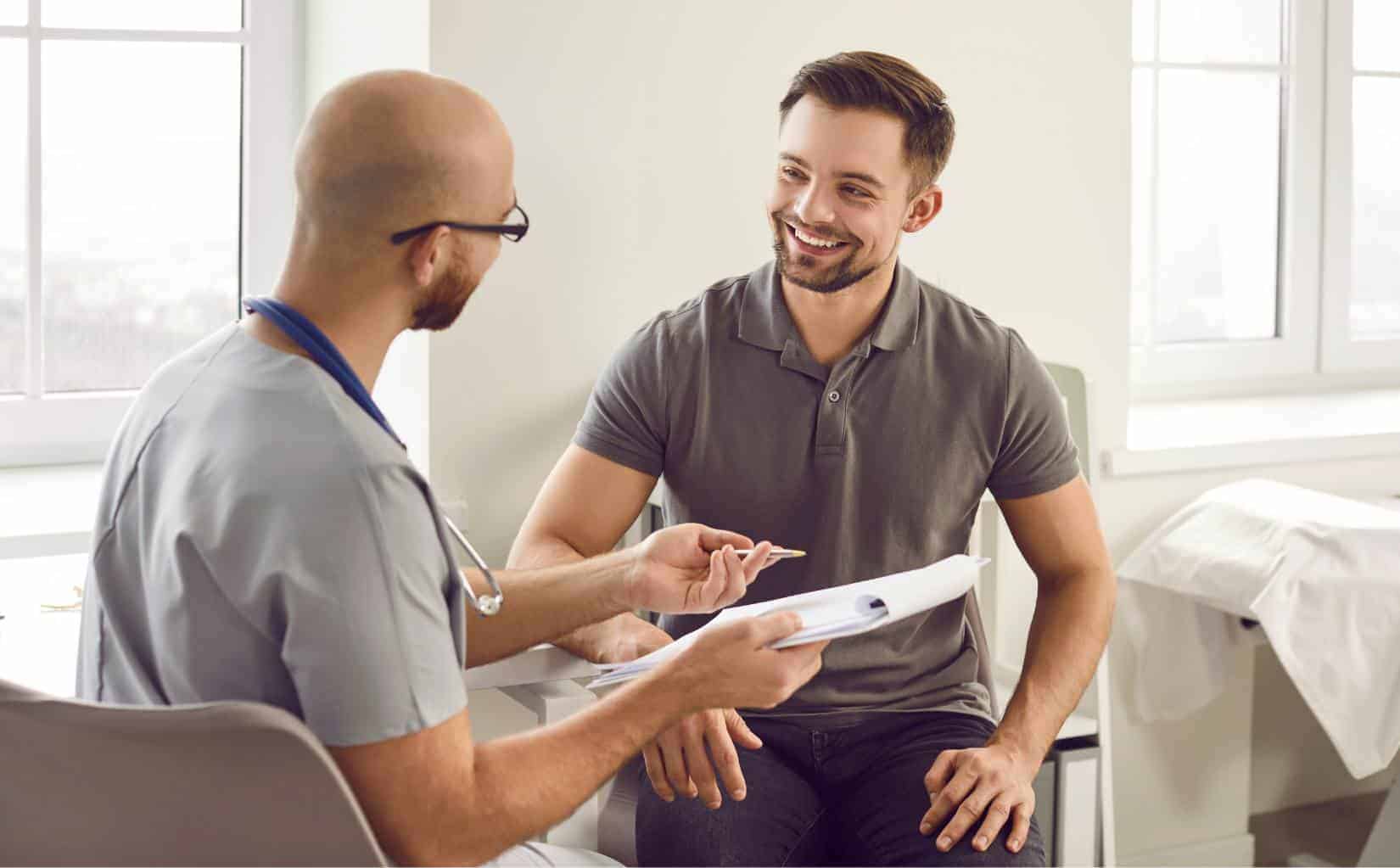 Man speaking with a specialist about insurance options for a mental health IOP in Madison, Wisconsin.