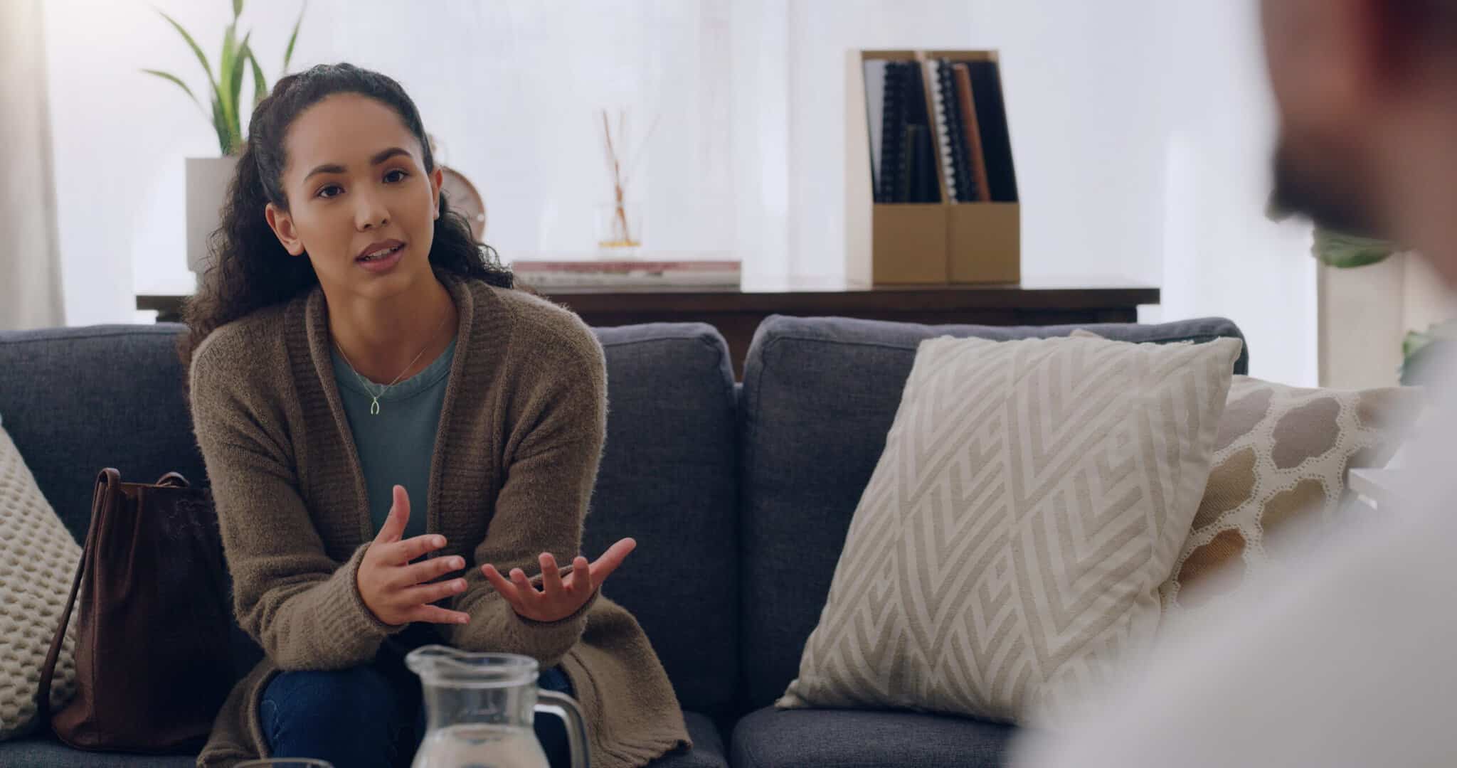 A woman asks about the signs weekly therapy isn't enough for depression during a consultation.